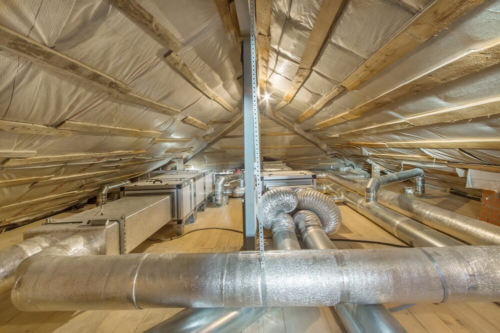 Insulated ducts and attic crawlspace in home with air source heat pump