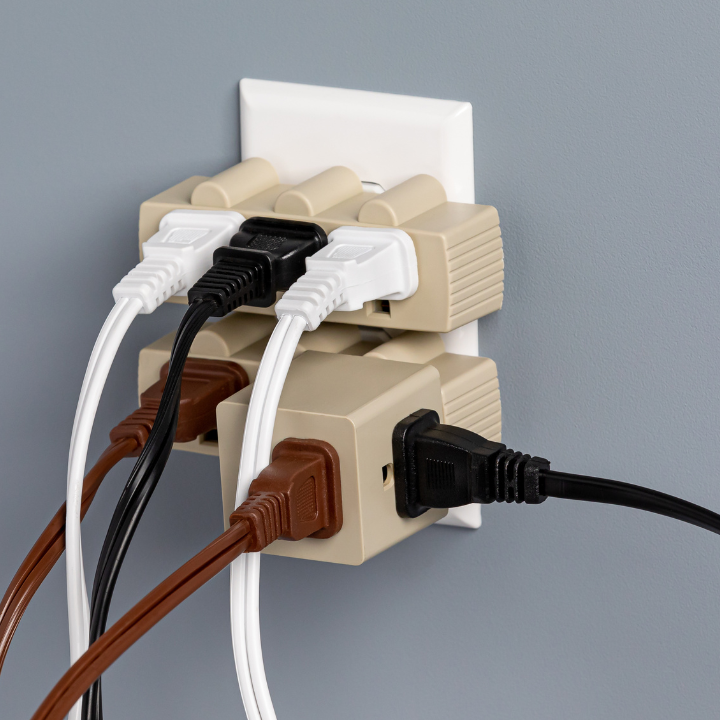 many plugs plugged into power outlet